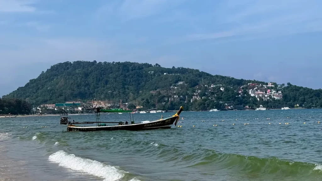 Longtail boat along the Patong Beach coastline in Phuket