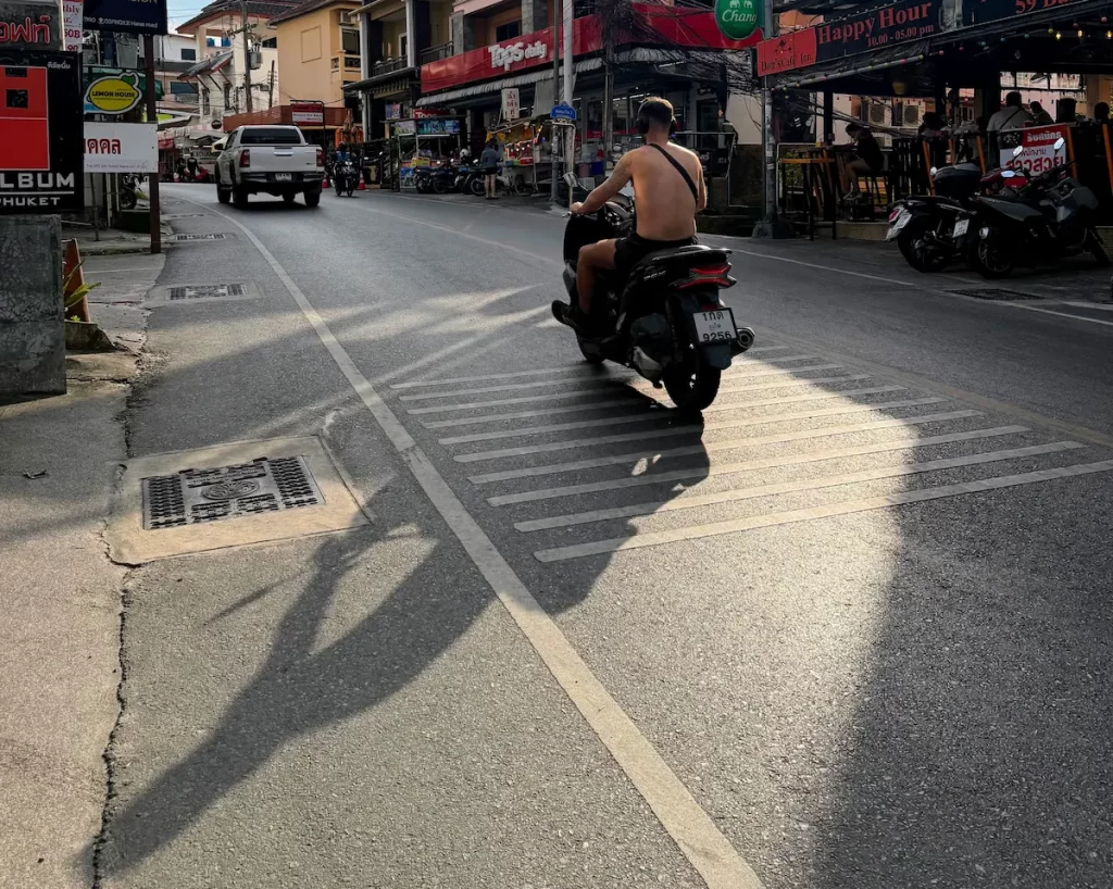 Quiet everyday street atmosphere in Patong Beach Phuket during late afternoon